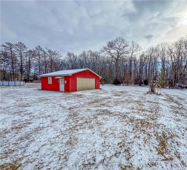 view of snow covered garage