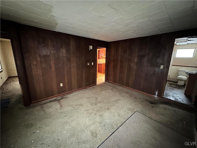 empty room with wood walls