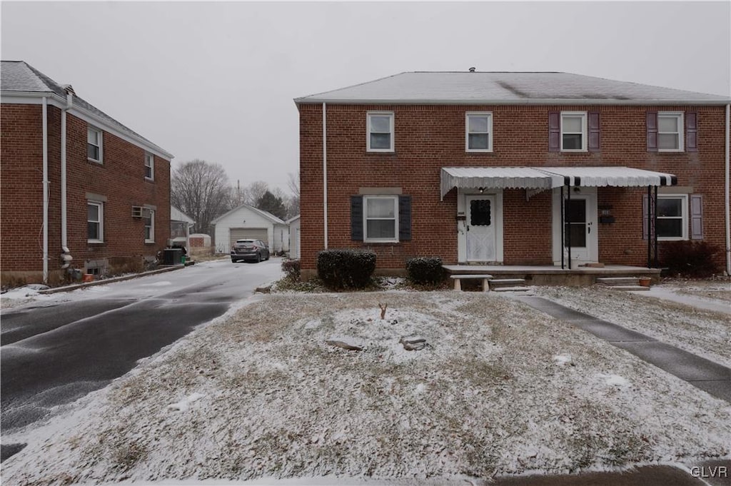 view of front of home featuring an outdoor structure and a garage