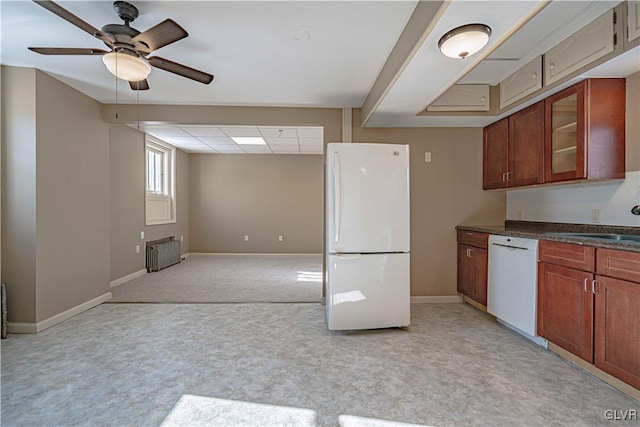 kitchen featuring radiator heating unit, ceiling fan, sink, and white appliances