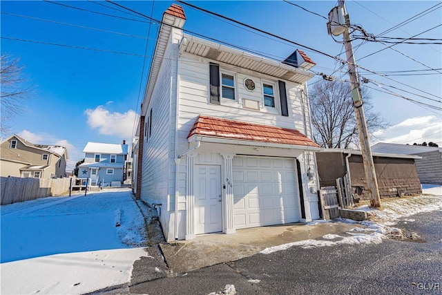 view of front of property with a garage