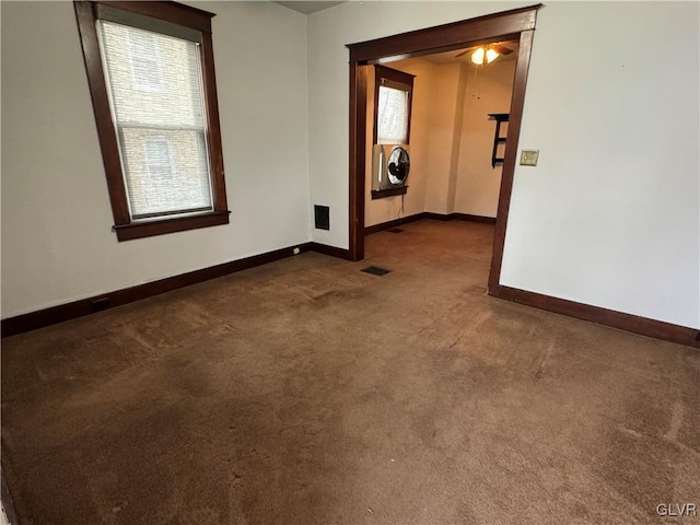 carpeted empty room with washer / clothes dryer