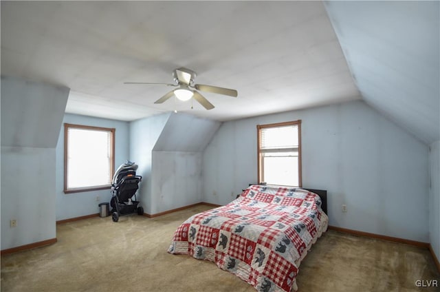 bedroom featuring ceiling fan, lofted ceiling, and light carpet