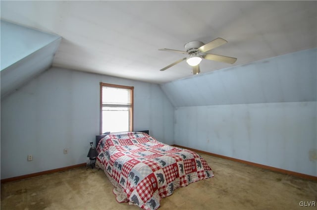 carpeted bedroom featuring ceiling fan and vaulted ceiling