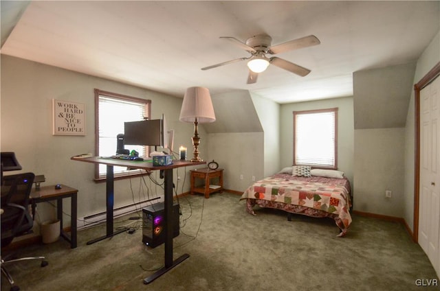 carpeted bedroom with ceiling fan, multiple windows, a baseboard heating unit, and a closet