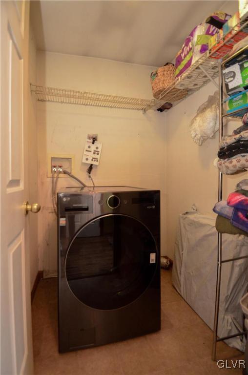 clothes washing area featuring washer / clothes dryer