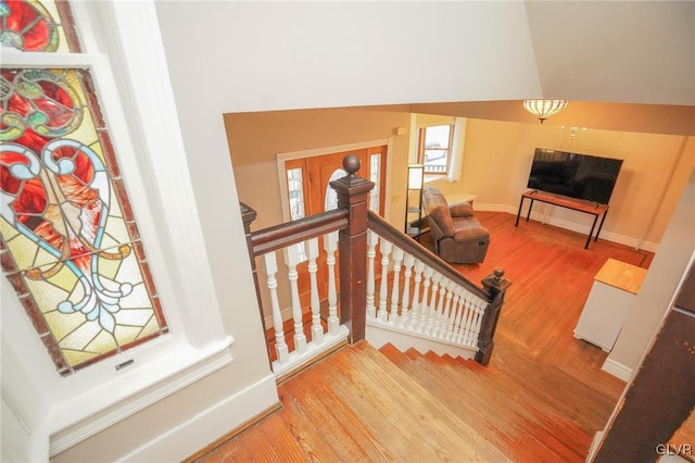 stairway featuring hardwood / wood-style floors