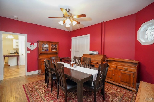 dining area featuring ceiling fan and light hardwood / wood-style flooring