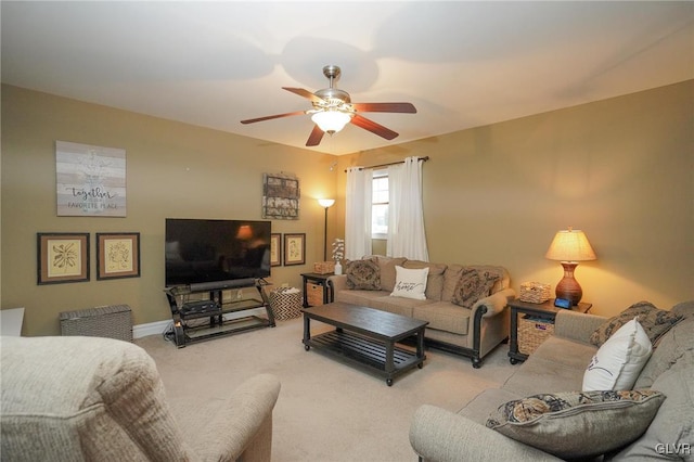 carpeted living room with ceiling fan