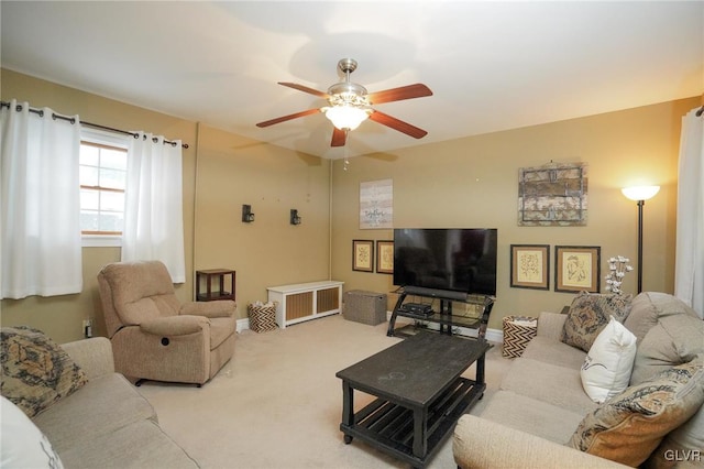 living room with ceiling fan and light colored carpet