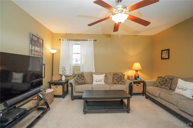 living room with ceiling fan and carpet flooring