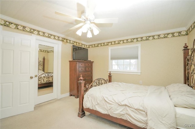 bedroom with ceiling fan, light colored carpet, and crown molding