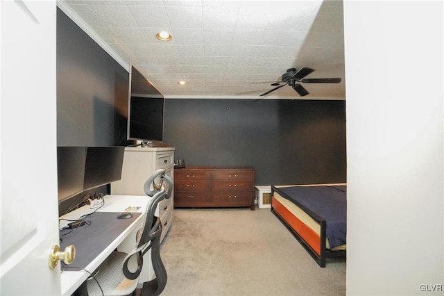 carpeted bedroom with ceiling fan and crown molding