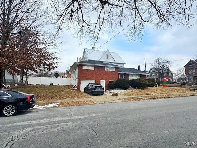 view of side of property featuring a garage