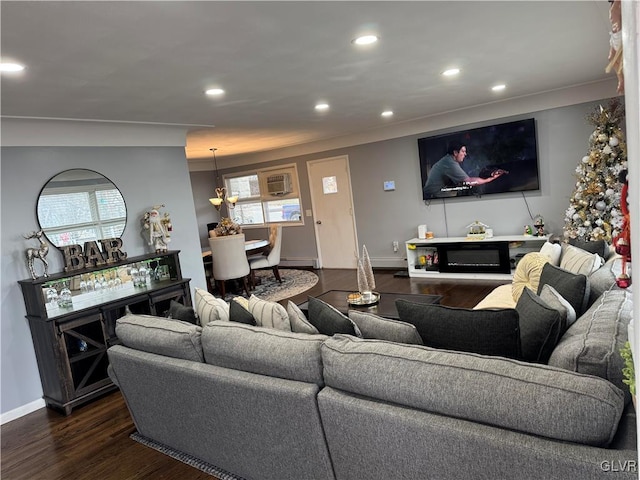 living room featuring a baseboard radiator and dark hardwood / wood-style flooring