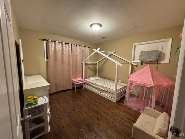 bedroom featuring dark hardwood / wood-style floors