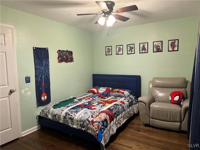 bedroom featuring ceiling fan and dark hardwood / wood-style floors