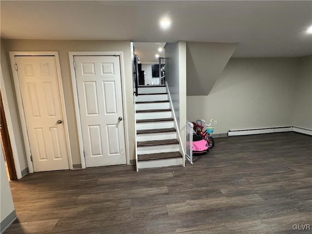 stairway with hardwood / wood-style floors