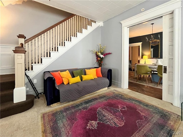 interior space featuring carpet flooring and a chandelier