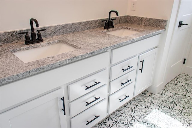 bathroom with vanity and tile patterned flooring