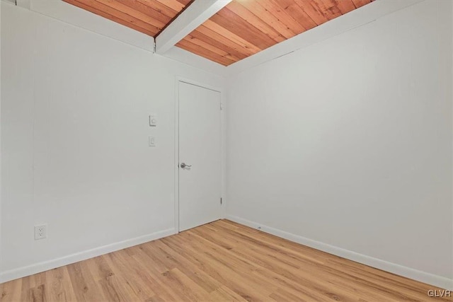 unfurnished room featuring wooden ceiling, beam ceiling, and light wood-type flooring