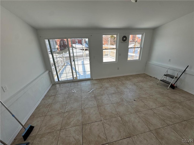 spare room with light tile patterned floors