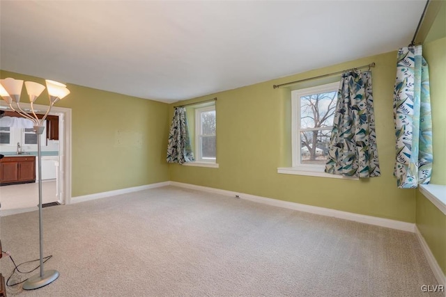 empty room featuring light carpet