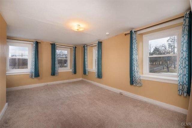 empty room with carpet flooring