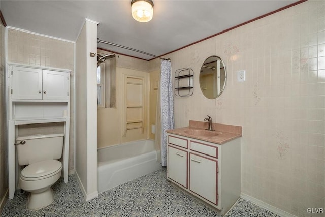 full bathroom featuring toilet, shower / bath combo, tile walls, ornamental molding, and vanity