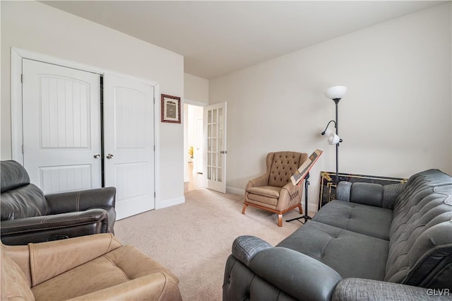 living room with light carpet and french doors