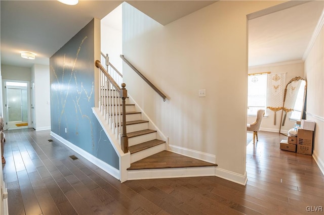 stairway featuring hardwood / wood-style flooring and ornamental molding