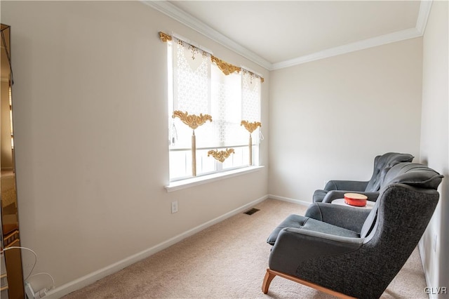 living area featuring carpet and crown molding