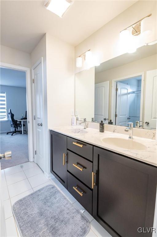 bathroom featuring tile patterned floors and vanity