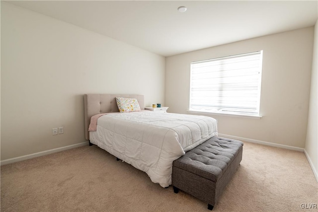 bedroom with light carpet