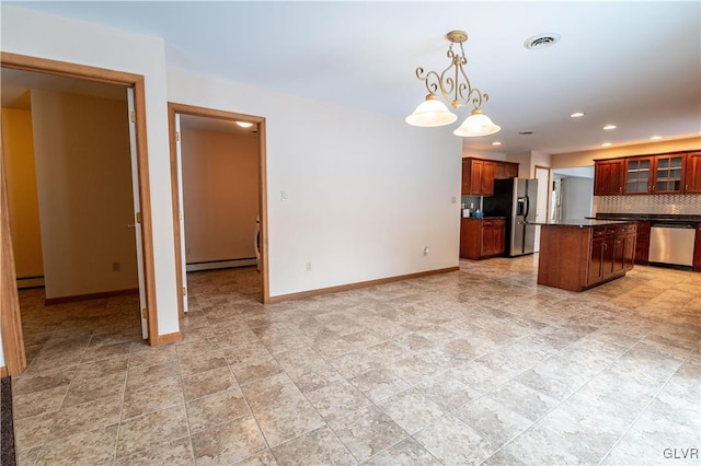 kitchen featuring a baseboard radiator, appliances with stainless steel finishes, a kitchen island, backsplash, and hanging light fixtures