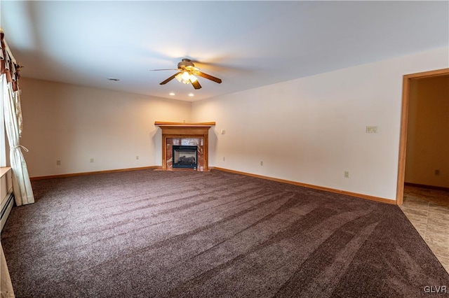 unfurnished living room featuring carpet floors, ceiling fan, and a fireplace