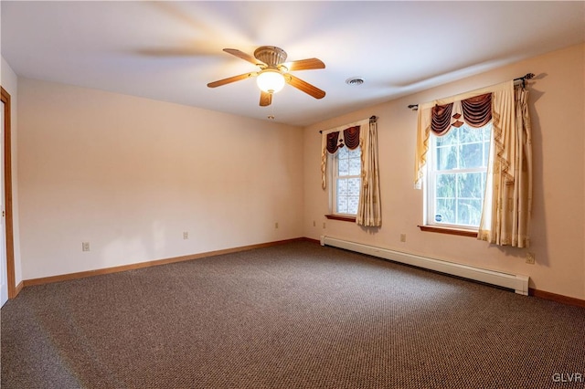 spare room with carpet floors, a baseboard heating unit, and ceiling fan