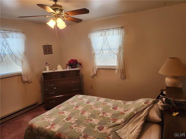 carpeted bedroom with ceiling fan and a baseboard radiator