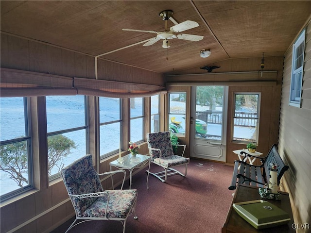 sunroom with wooden ceiling, a wealth of natural light, and a water view