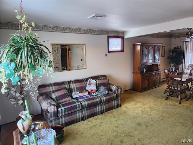 carpeted living room featuring baseboard heating