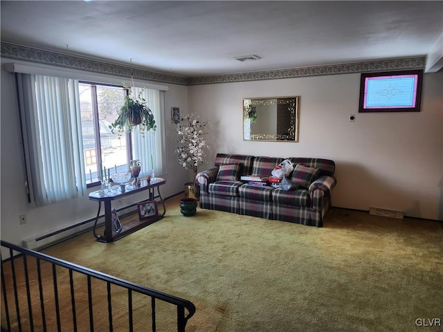 carpeted living room with a baseboard heating unit