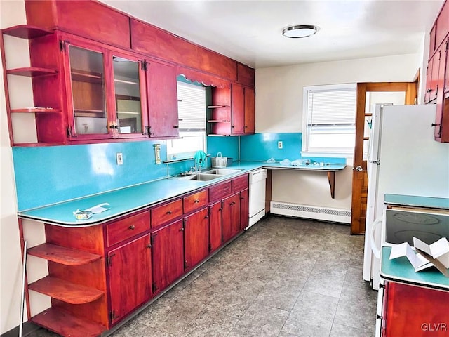 kitchen with sink, white appliances, and a baseboard radiator