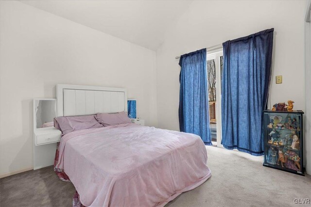 carpeted bedroom featuring vaulted ceiling