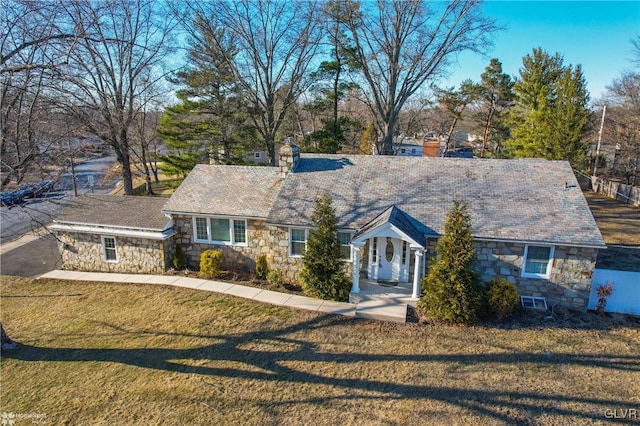 single story home featuring a front yard