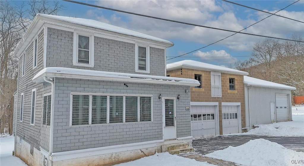 view of front of property with a garage