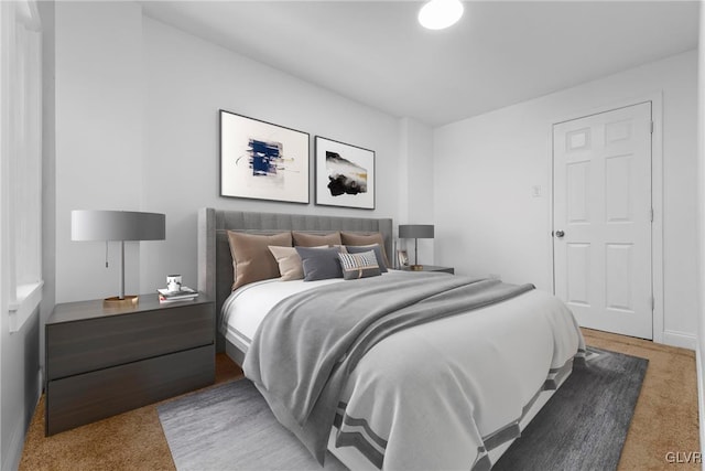 bedroom featuring light colored carpet