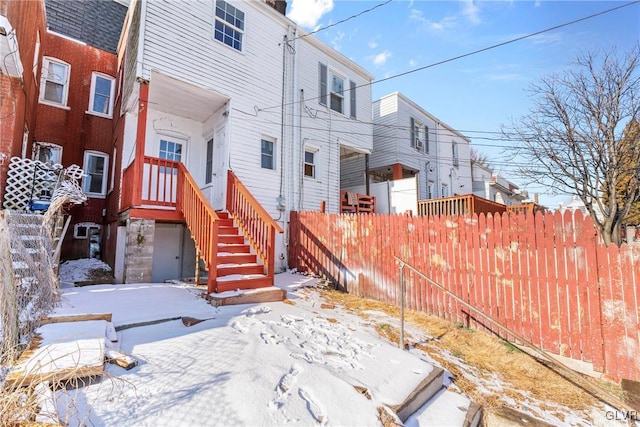 view of snow covered house