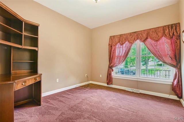 empty room with carpet flooring