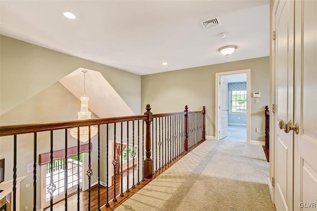 hallway featuring carpet flooring