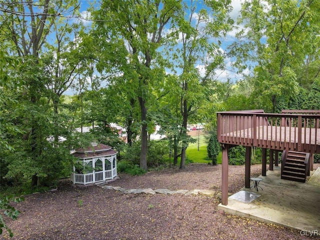 view of yard featuring a wooden deck